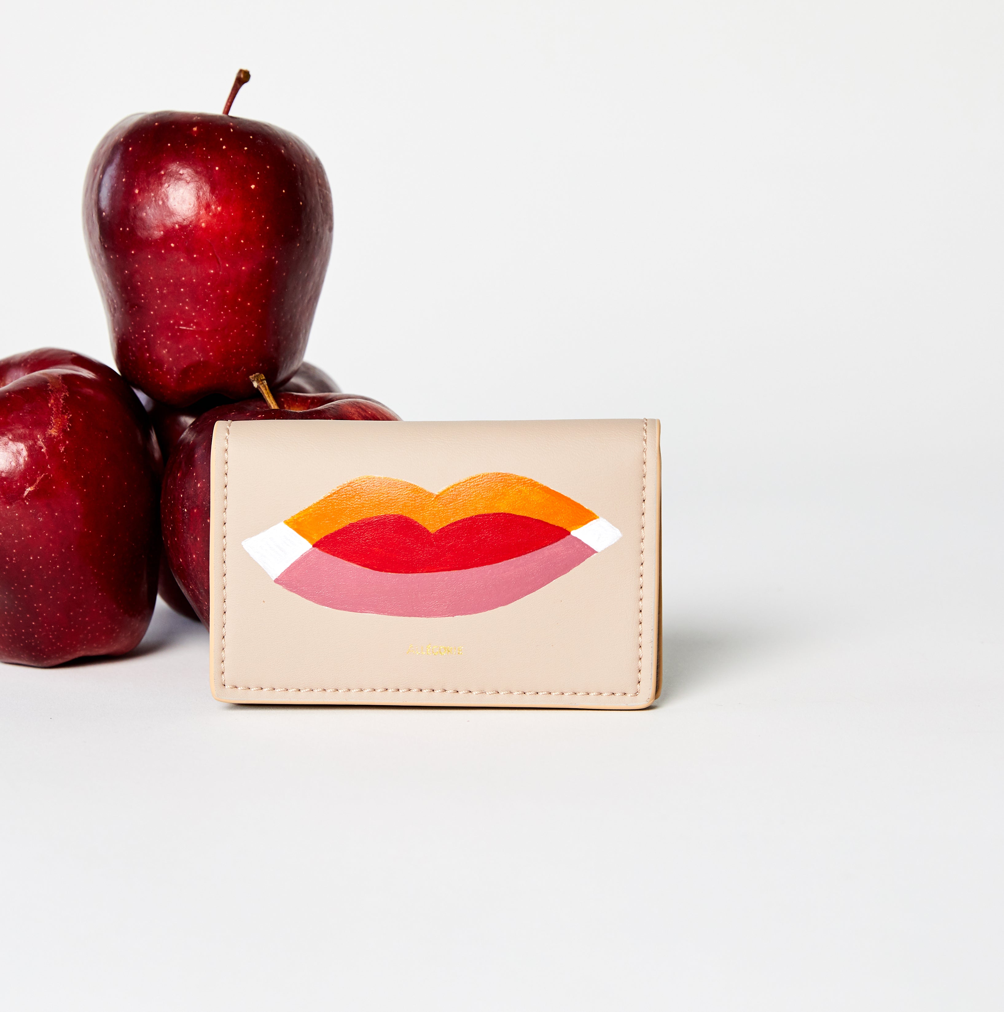 hand painted by LGBTQA+ artist on vegan sustainable cardholder in pink 