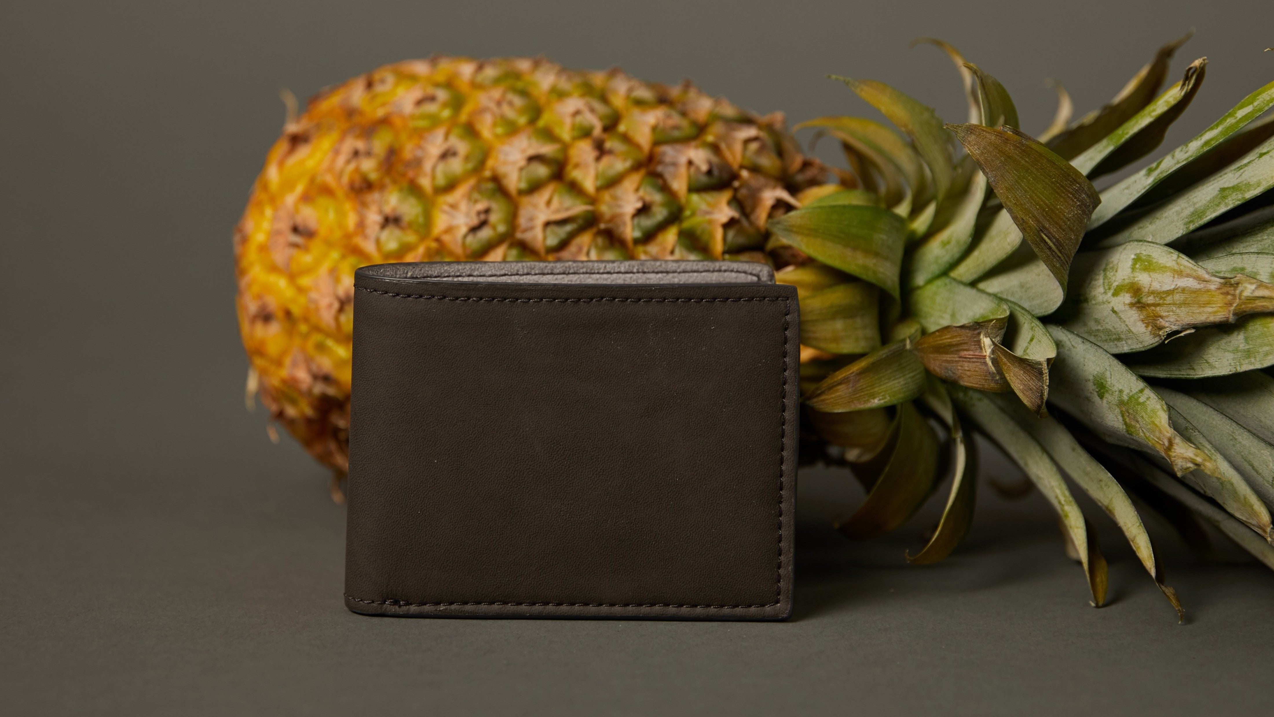 dark grey wallets made from pineapple leaves