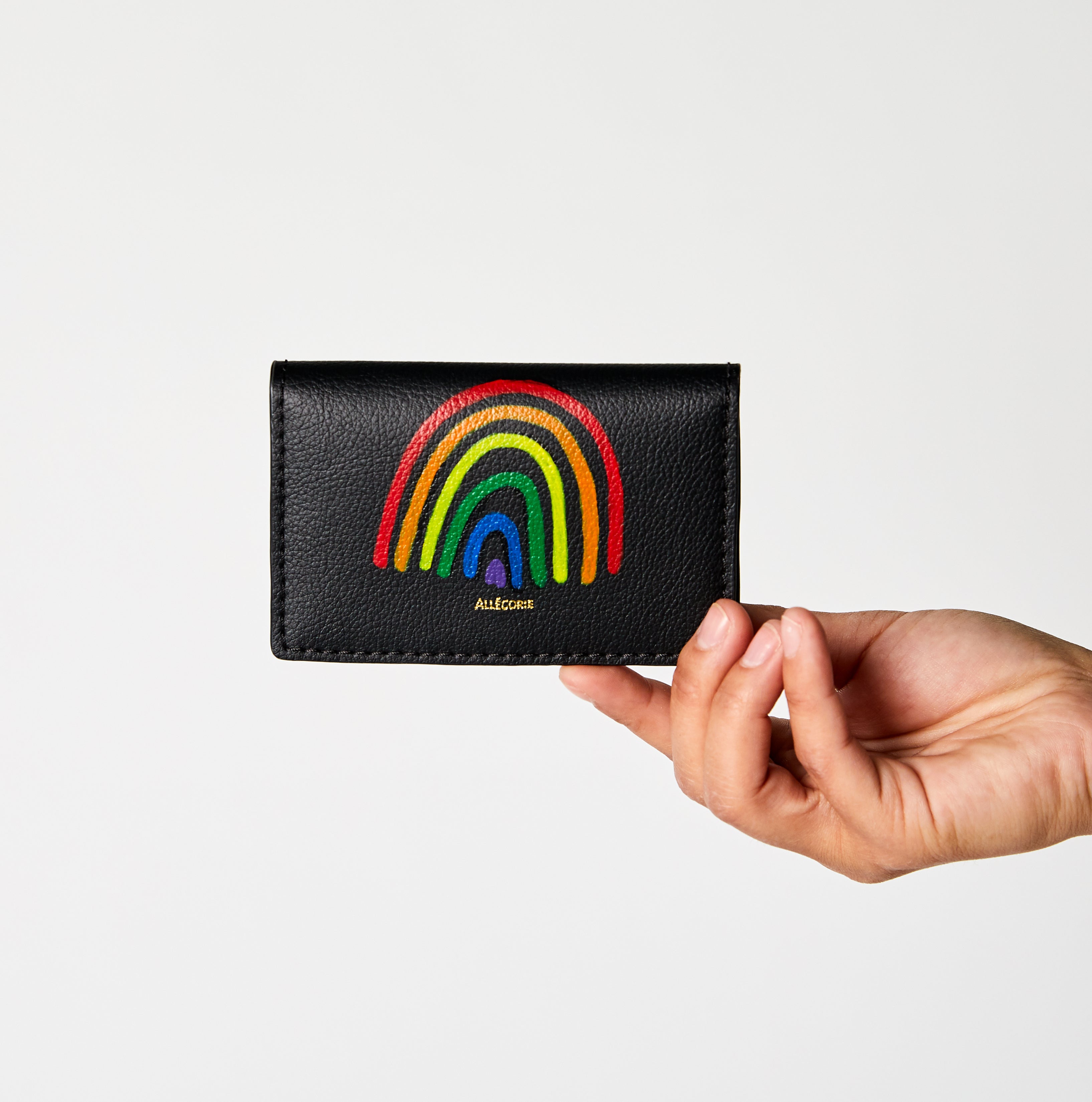 pride rainbow hand painted y LGBTQ artist on vegan sustainable black cardholder.