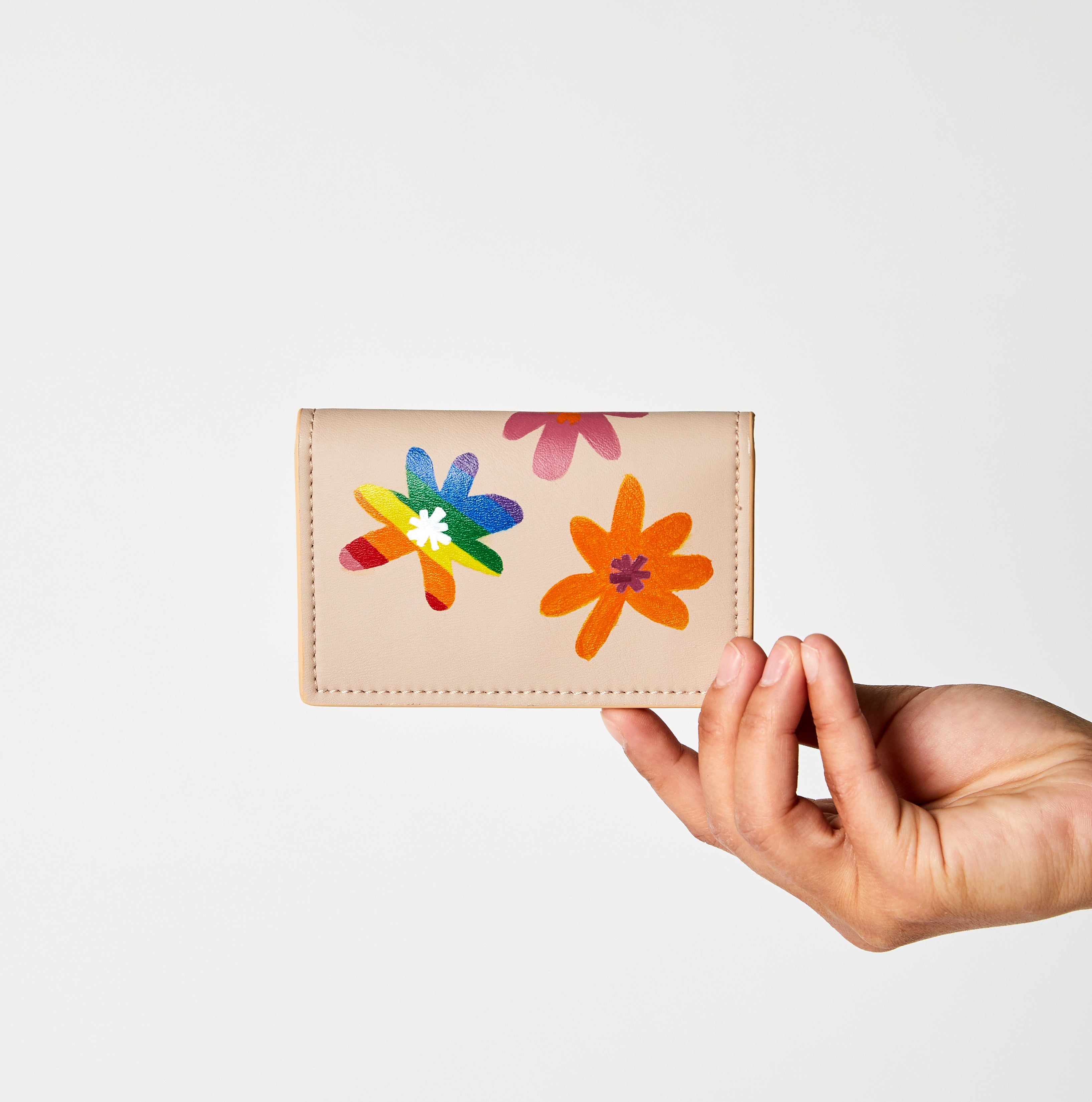 pride flower hand painted by LGBTQ artist on vegan sustainable cardholder