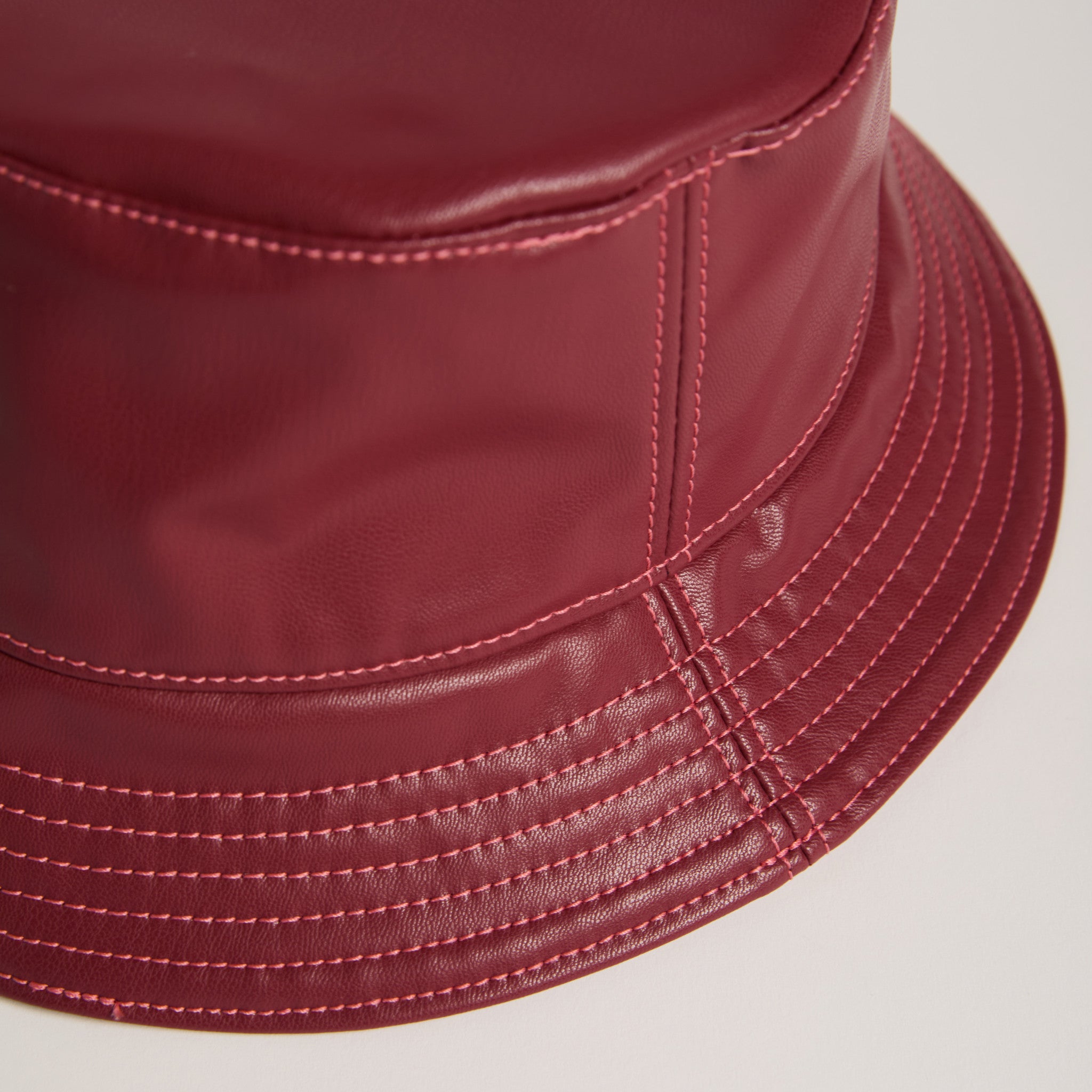 Apple leather wine bucket hat detail